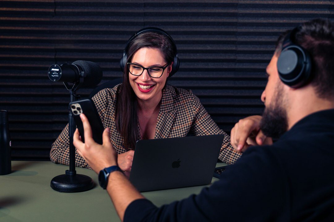host and guest laughing during podcast