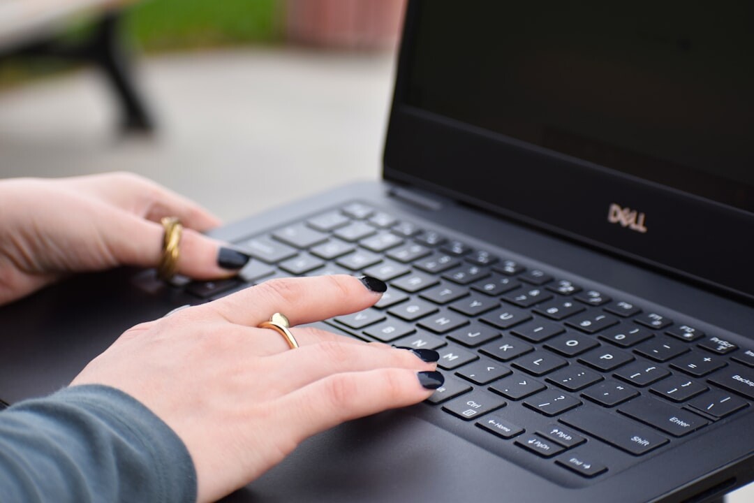 writer typing on laptop