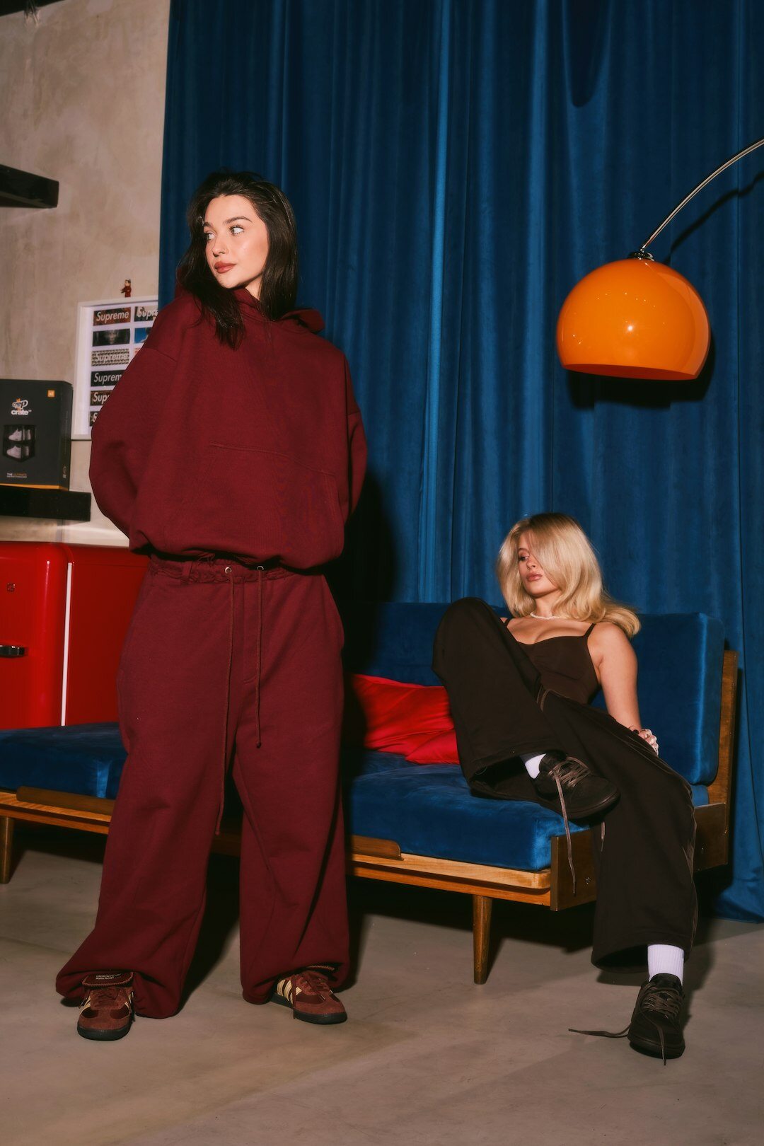 Two podcast hosts recording an episode in a modern studio